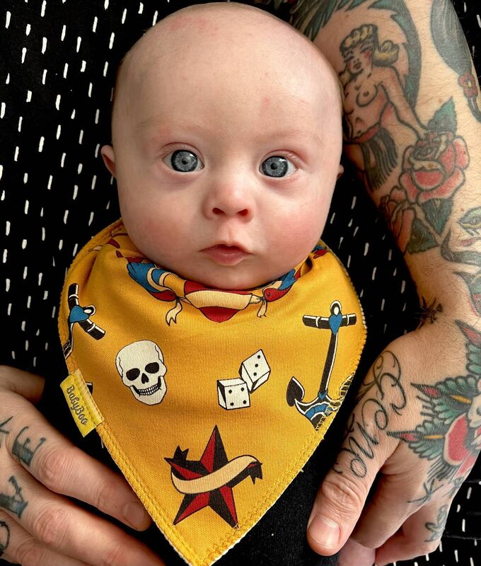 Gene Daly wearing one of the bibs his parents designed for Cork-founded company, Babyboo.ie. One euro from every bib sale will go to the Down Syndrome Centre.