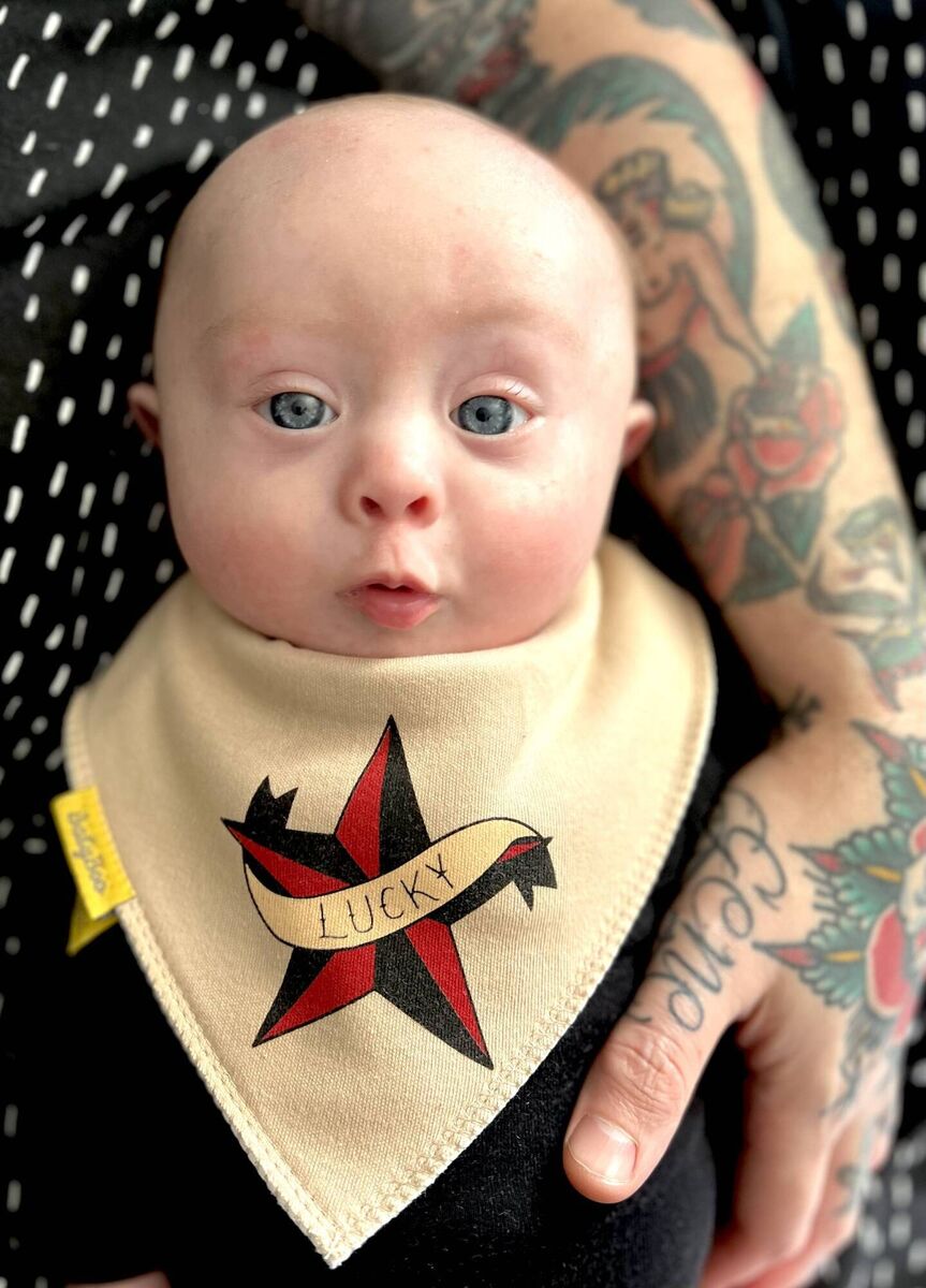Gene wearing another bib designed by mum and dad. Gene wearing another bib designed by mum and dad.