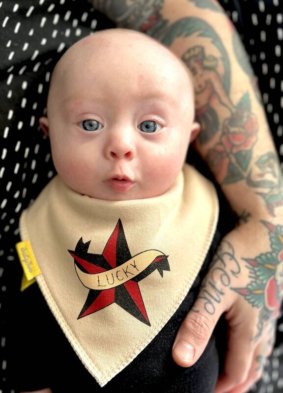 Gene wearing another bib designed by mum and dad.