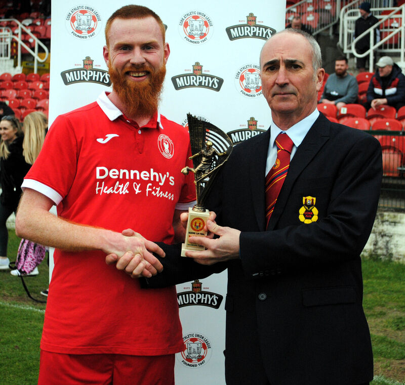 Cathal Hughes presents the Man of the Match award (sponsored by Gary McCarthy Trophies) to Dalian Roche. Picture: Barry Peelo.