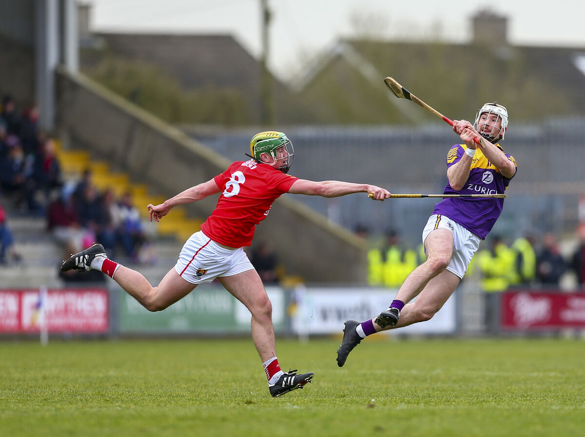 Wexford’s Oisin Foley gets a shot away from Cork’s Brian Roche last weekend. Picture: INPHO/Ken Sutton