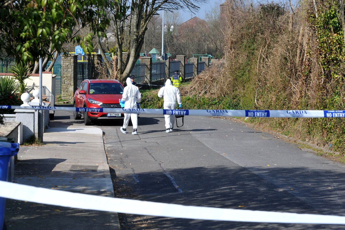 Crime scene investigators at the scene on Saturday morning. Picture: Larry Cummins