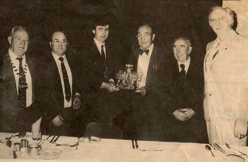 A young Cllr Micheál Martin, deputising for the Lord Mayor, presenting the Cork Ex-Boxers Association Hall of Fame award to his father Paddy at the Sunset Ridge Hotel in October 1985.. Also included are Roy O'Sullivan of Dublin Ex-Boxers (on left), Tim O'Sullivan, Treasurer, John 'Kid' Cronin ,President ,and Ray Donnelly, Tresurer of the CEBA. 