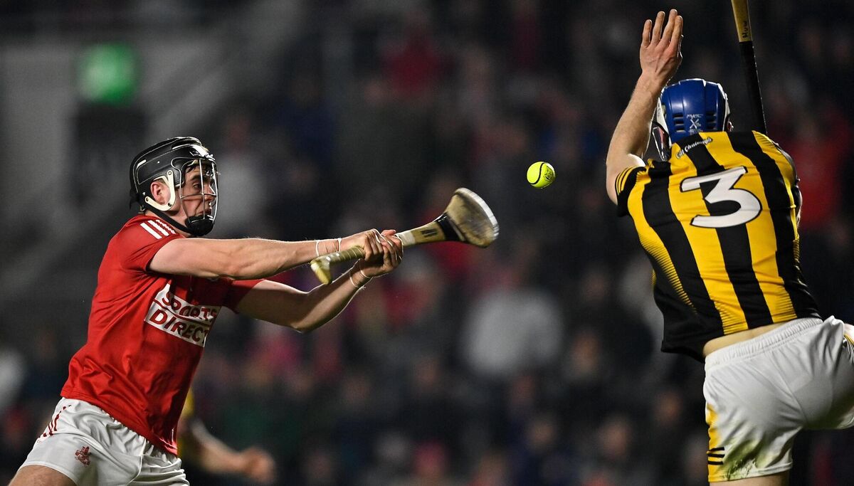 Darragh Fitzgibbon of Cork shoots to score his side's goal, despite the efforts of Huw Lawlor of Kilkenny. Picture: Piaras Ó Mídheach/Sportsfile