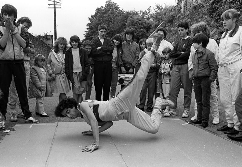 Anthony Crowley, Dillons Cross, giving an exhibition of break-dancing to the children of the Lower Road, during the Cork 800 Pageant at Grattan Hill in July, 1985. Anthony Crowley, Dillons Cross, giving an exhibition of break-dancing to the children of the Lower Road, during the Cork 800 Pageant at Grattan Hill in July, 1985.