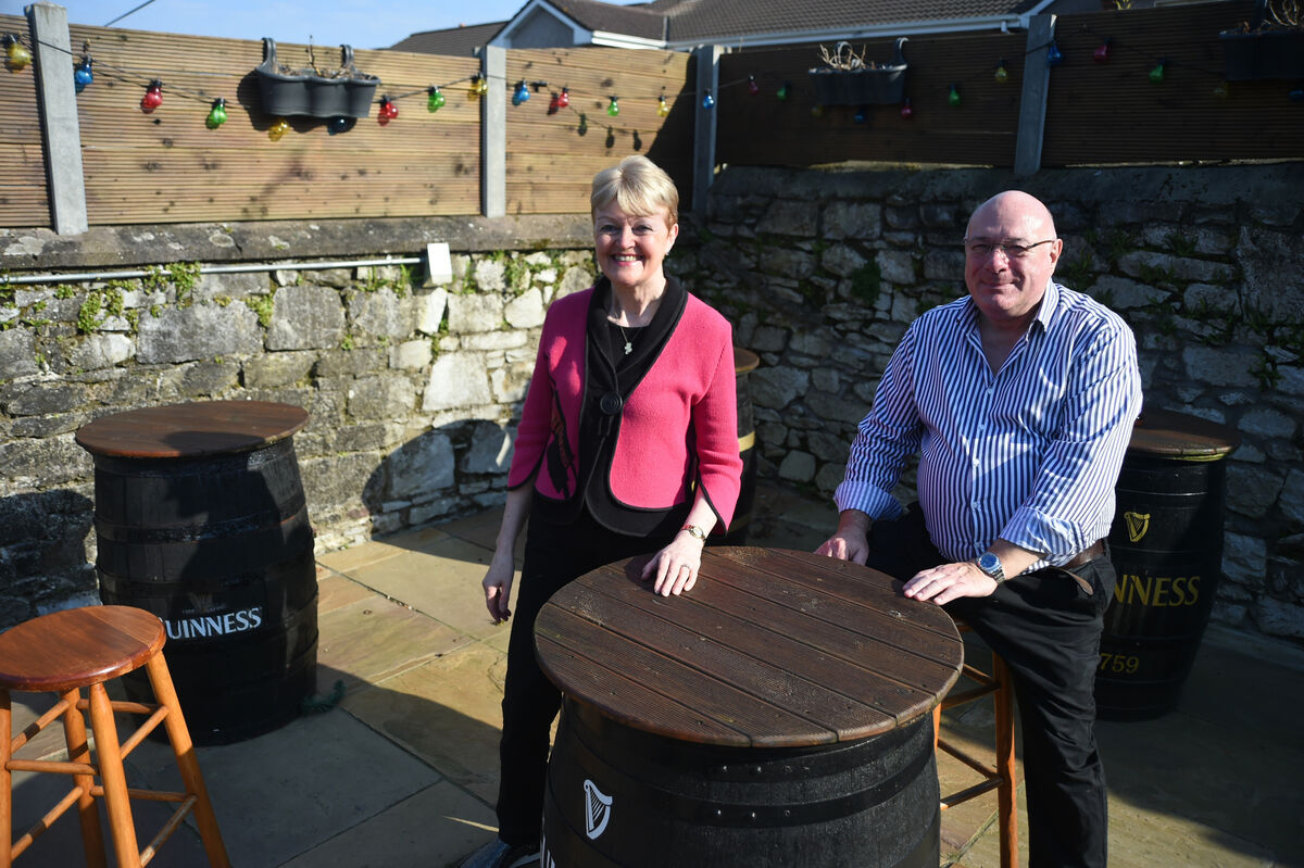 Proprietors Kate Tierney and Con Dennehy in the outdoor beer garden at The Venue Bar, Ballintemple