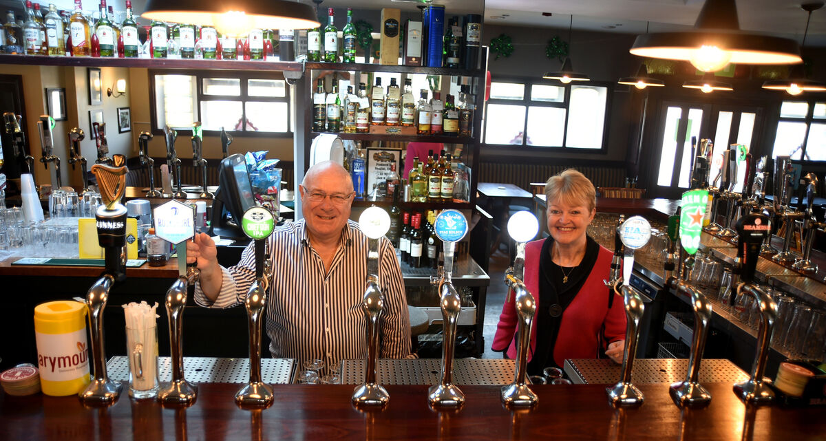 Proprietors Con Dennehy and Kate Tierney behind the counter at The Venue Bars, Ballintemple, Cork city.