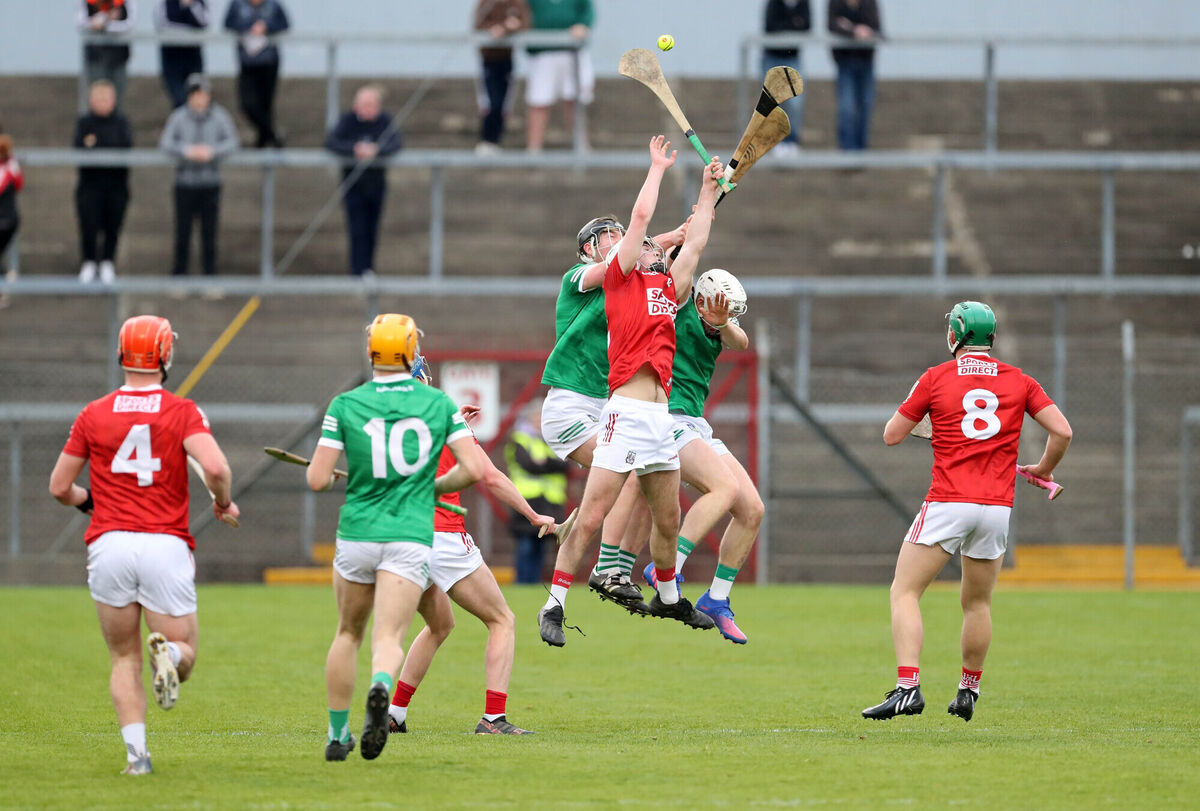  Denis McSweeney of Cork battles in the air against Limerick pair Cian Scully and Jimmy Quilty. Picture: Jim Coughlan