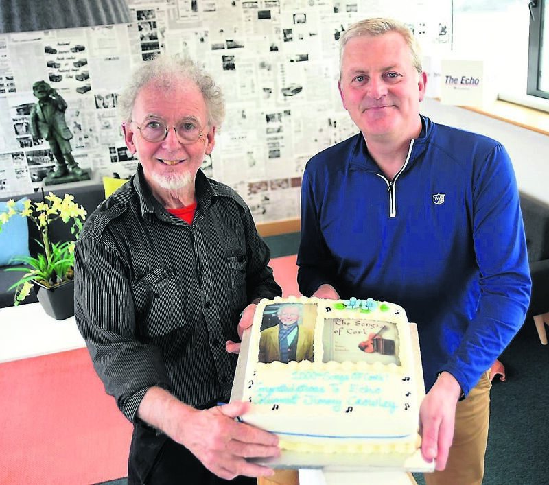 Jimmy receives a special cake marking his 1,000th edition of ‘The Songs of Cork’ column in The Echo from Features Editor John Dolan. Picture: Larry Cummins