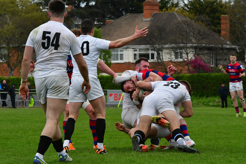  Clontarf's Andrew Smith appears to be outnumbered by Cork Con. Picture: Moya Nolan