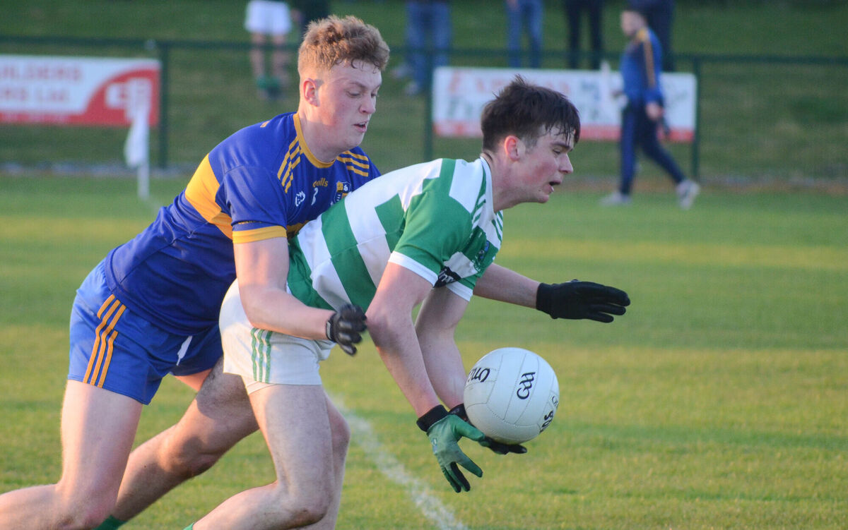Valley Rovers Ciaran O'Shea is challenged from behind by Carrigaline's Patrick Mellett during the SE U21 A FC Final in Shanbally. Picture: Howard Crowdy