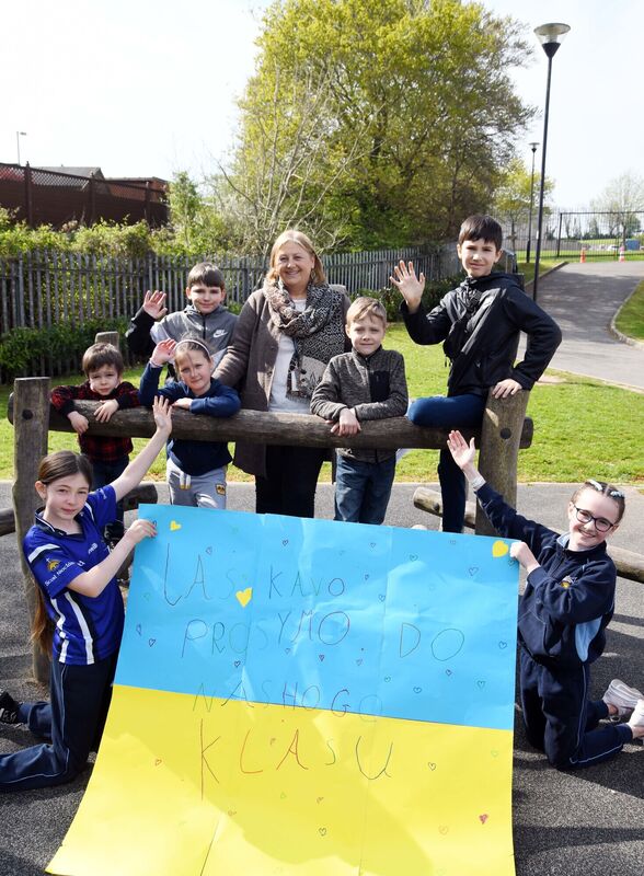 Two Scoil Niocláis, Frankfield, Cork, pupils (front) and Rosemary Lee, deputy principal, welcoming the newly arrived pupils from Ukraine to the school. Picture Denis Minihane.
