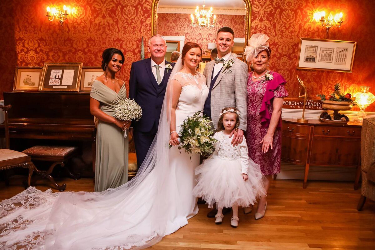 The couple pictured with family. The couple pictured with family.