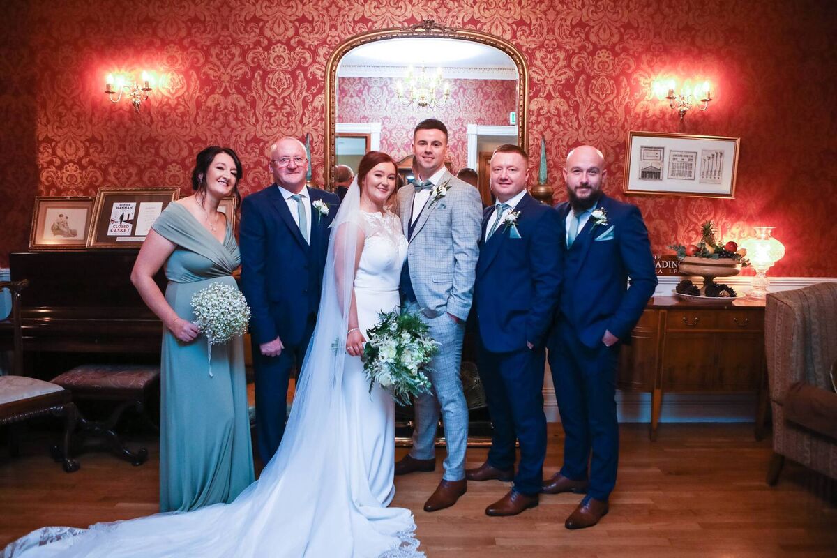 The couple pictured with family. The couple pictured with family.