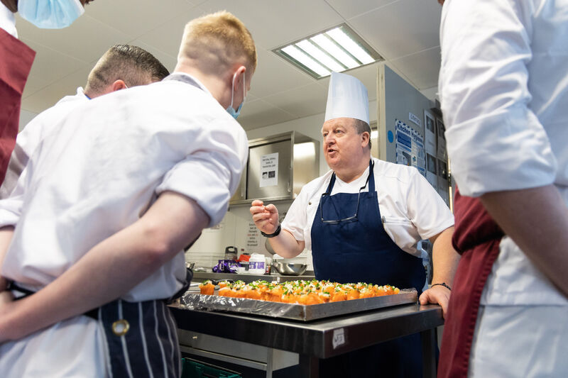 JJ Healy, Lecturer Dept of Tourism and Hospitality MTU teaching teaching culinary skills to participants of the Open Door programme before the Open Door event in Cork Prison. Photo Darragh Kane. JJ Healy, Lecturer Dept of Tourism and Hospitality MTU teaching teaching culinary skills to participants of the Open Door programme before the Open Door event in Cork Prison. Photo Darragh Kane.