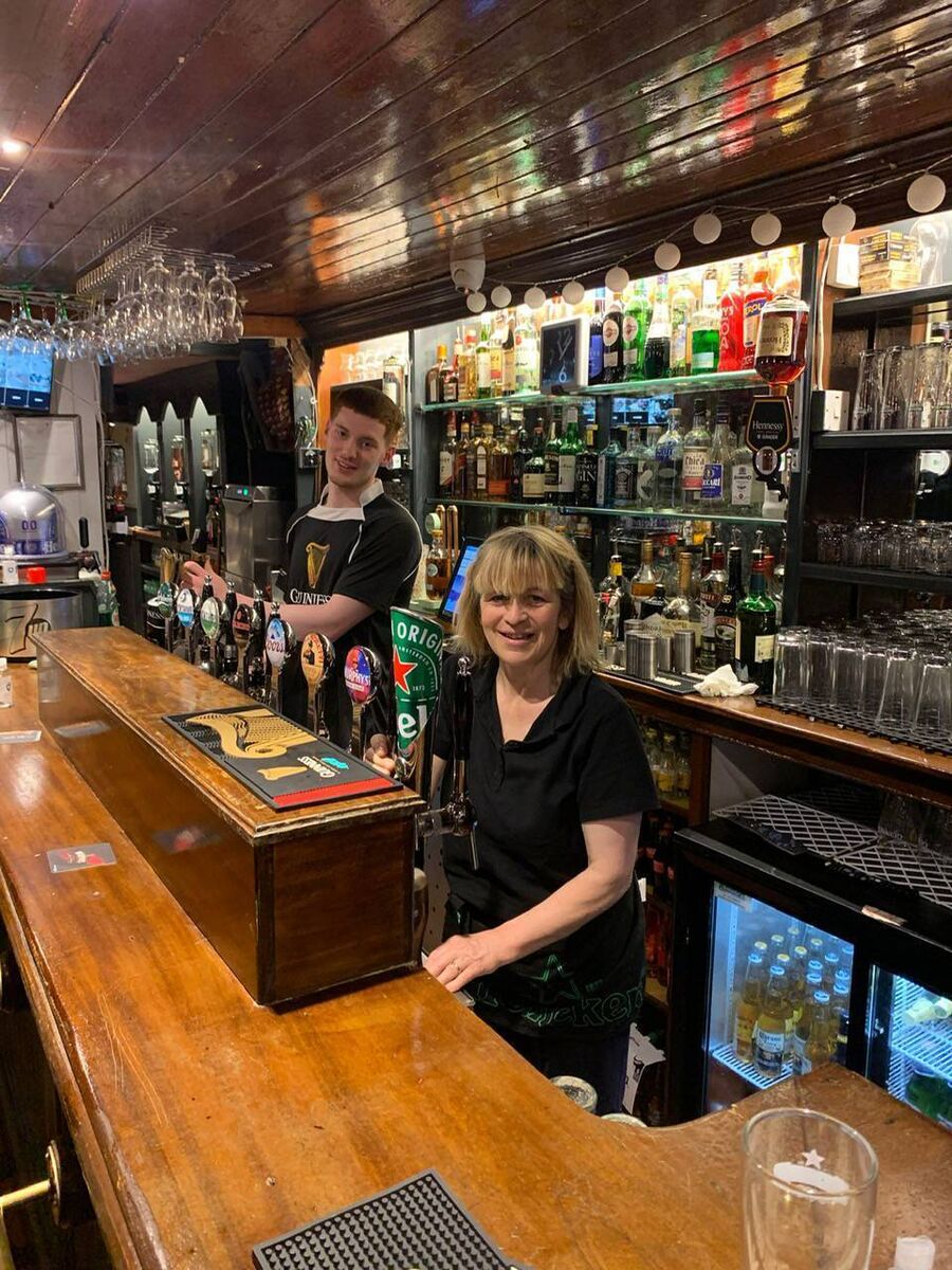 Jack Buckley and Mary O'Shea serving pints in Buckley's Bar. Jack Buckley and Mary O'Shea serving pints in Buckley's Bar.