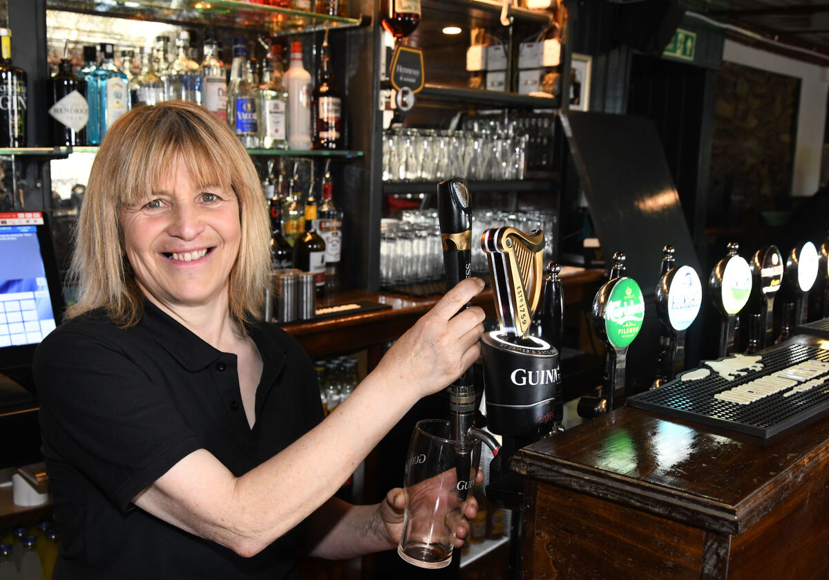 Mary O'Shea, head bar person, in the bar. Mary O'Shea, head bar person, in the bar.