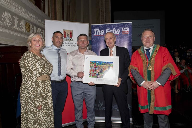 Maurice Gubbins, editor of the The Echo and Echolive.ie presenting a Community and Voluntary Award to the Two Norries's James Leonard and Timmy Long in the Health & Wellbeiing category. The awards took place at Cork City Hall. Maurice Gubbins, editor of the The Echo and Echolive.ie presenting a Community and Voluntary Award to the Two Norries's James Leonard and Timmy Long in the Health & Wellbeiing category. The awards took place at Cork City Hall.