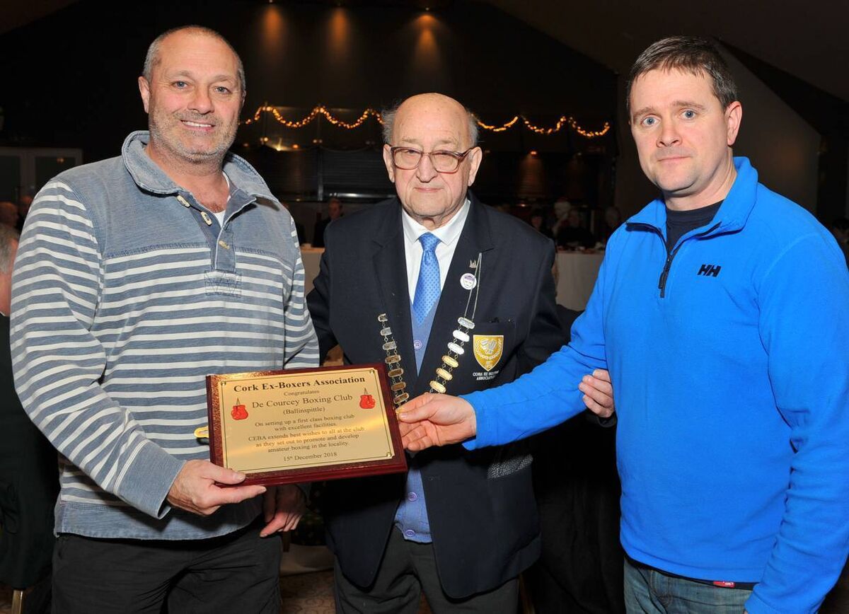 Tim O'Sullivan, President of the Cork Ex-Boxers Association presenting a congratulatory plaque to Will Rossall and Dave Ryan, members of Cork's newest Boxing Club, De Courcey BC of Ballinspittle. Picture: Doug Minihane.