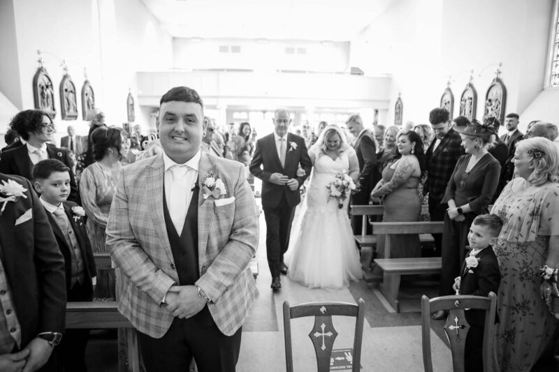 Malcom waiting at the top of the church for his bride. Malcom waiting at the top of the church for his bride.