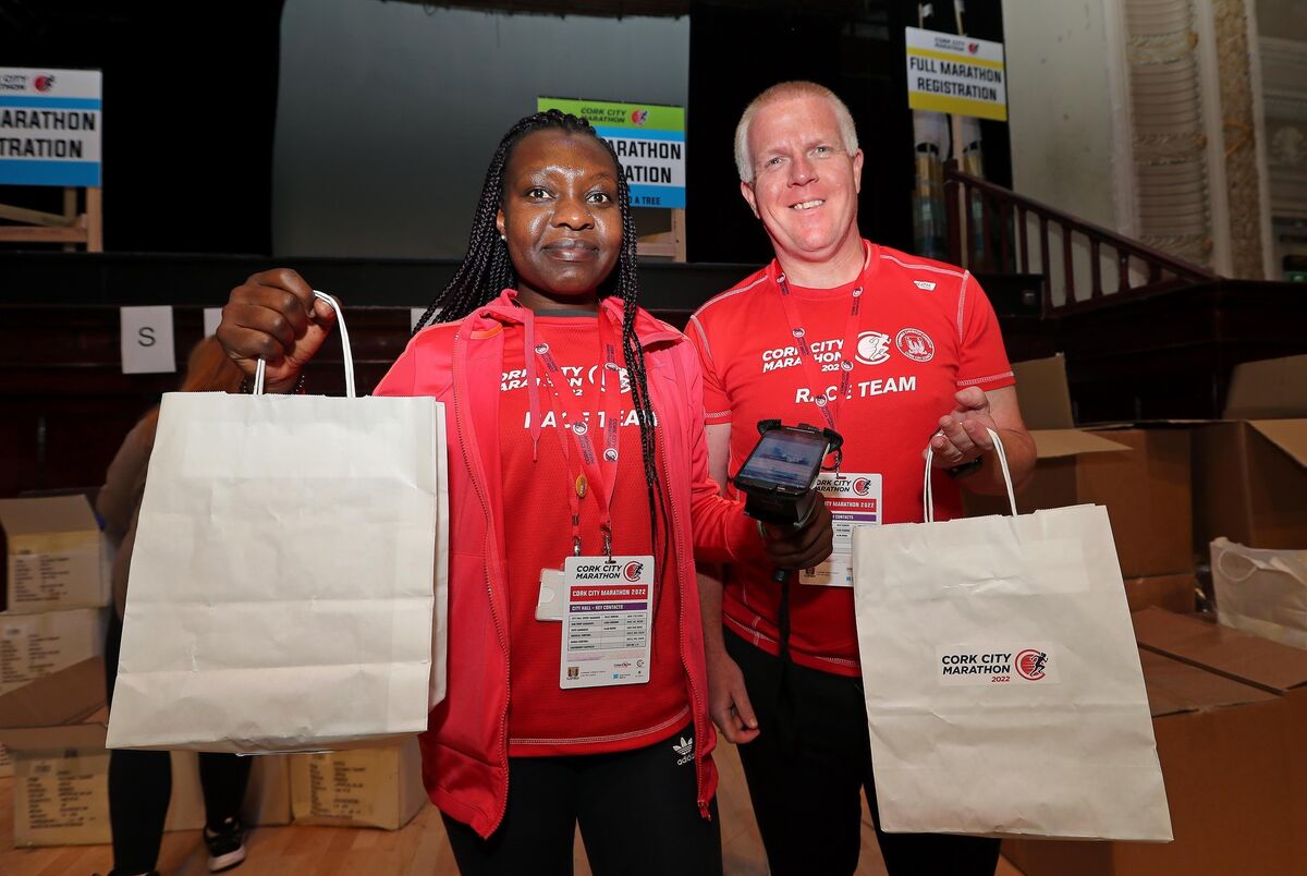 Pictured are, Busie Mhlophe and Gary O'Donovan, Volunteers, at the 2022 Cork City Marathon Registration and Expo, at the Concert Hall, City Hall, Cork. Picture: Jim Coughlan.