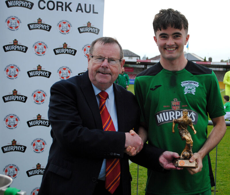 AUL chairman Tom Fitzgerald presents the Man of the Match award (sponsored by Gary McCarthy Trophies) to Coachford's Cialan O'Sullivan. Picture: Barry Peelo.