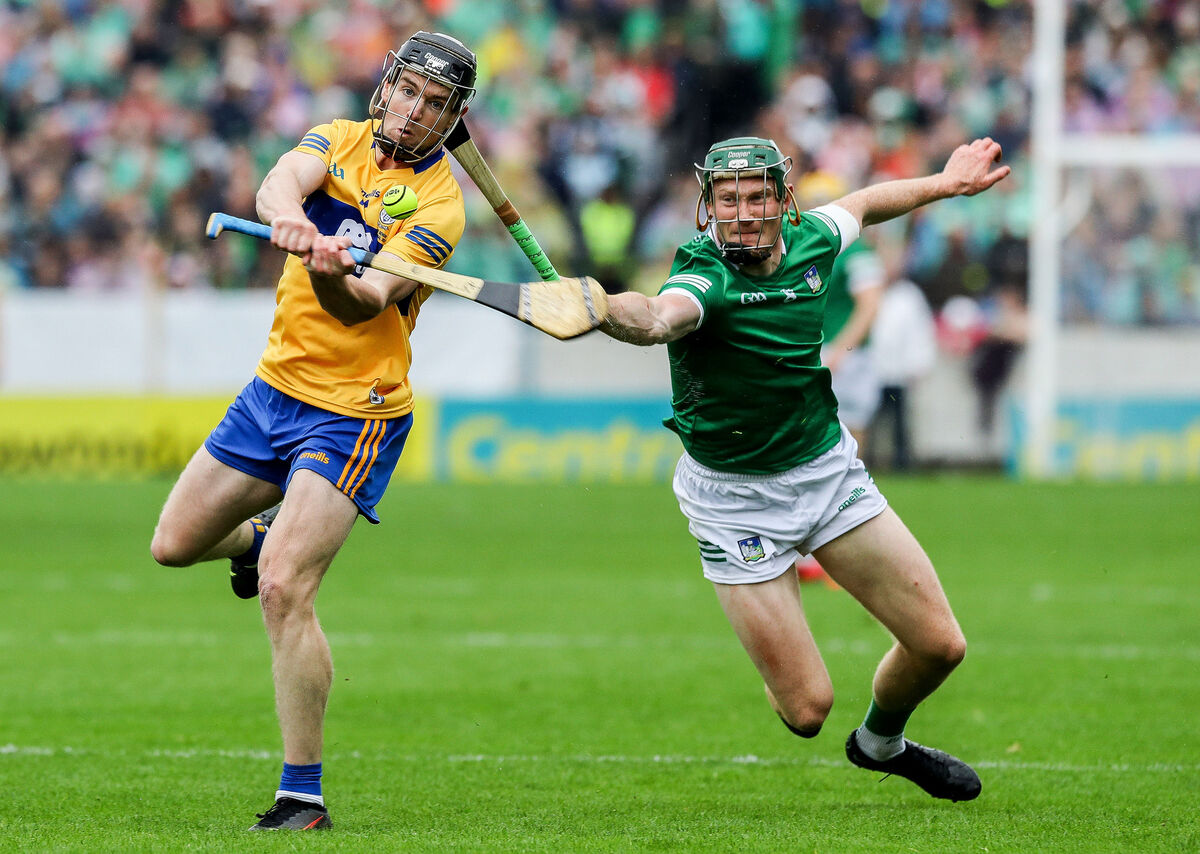 Clare's Tony Kelly and William O'Donoghue of Limerick. Picture: INPHO/Lorraine O’Sullivan