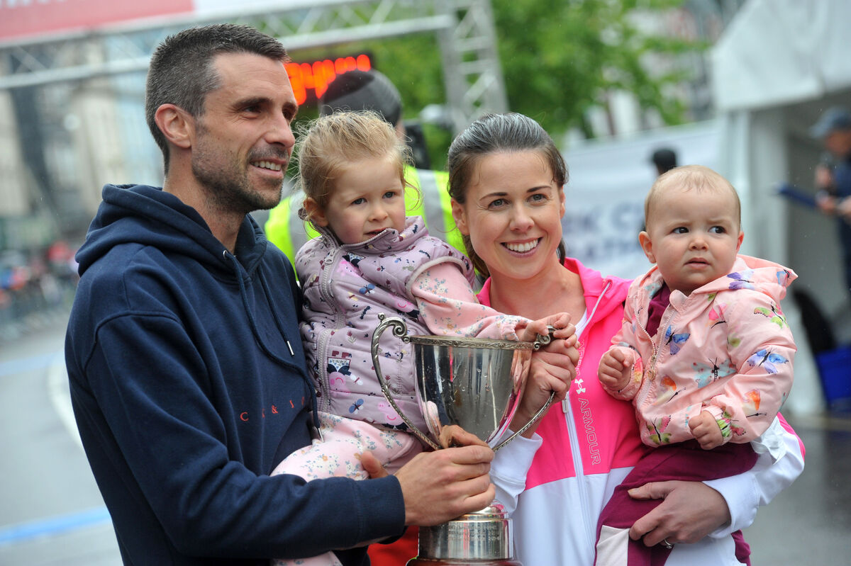  Race winner Tim O'Donoghue, East Cork AC with wife Eimear O'Sullivan and children Chloe and Eabha at the finish line on St Patrick's Street in the Cork City Marathon on Sunday 5th June 2022. Pic: Larry Cummins