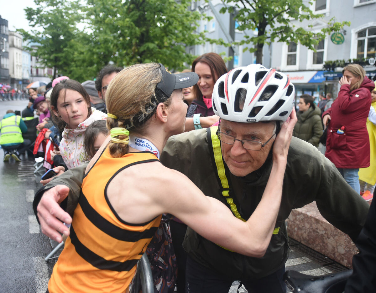  Marathon race female winner Lizzie Lee, Leevale AC has a kiss for dad Gearoid O'Laoi at the finish line on St Patrick's Street in the Cork City Marathon on Sunday 5th June 2022. Pic: Larry Cummins