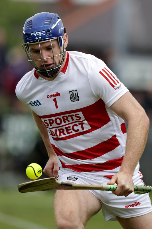 Cork's Patrick Collins drives out with the sliotar. Picture: INPHO/John McVitty