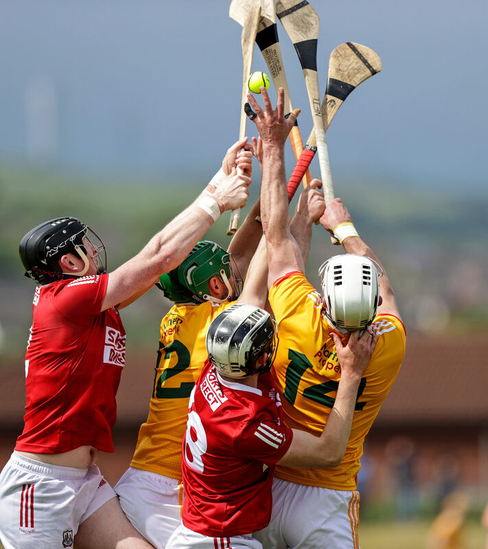 The Cork and Antrim players contest a puck-out. Picture: INPHO/John McVitty