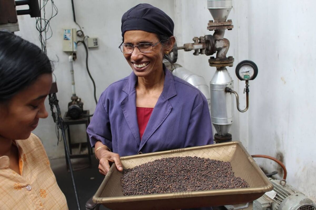 Bhagya Barrett, of Rebel City Distillery  with a representative from the Kerala Women’s Co-Operative. 
