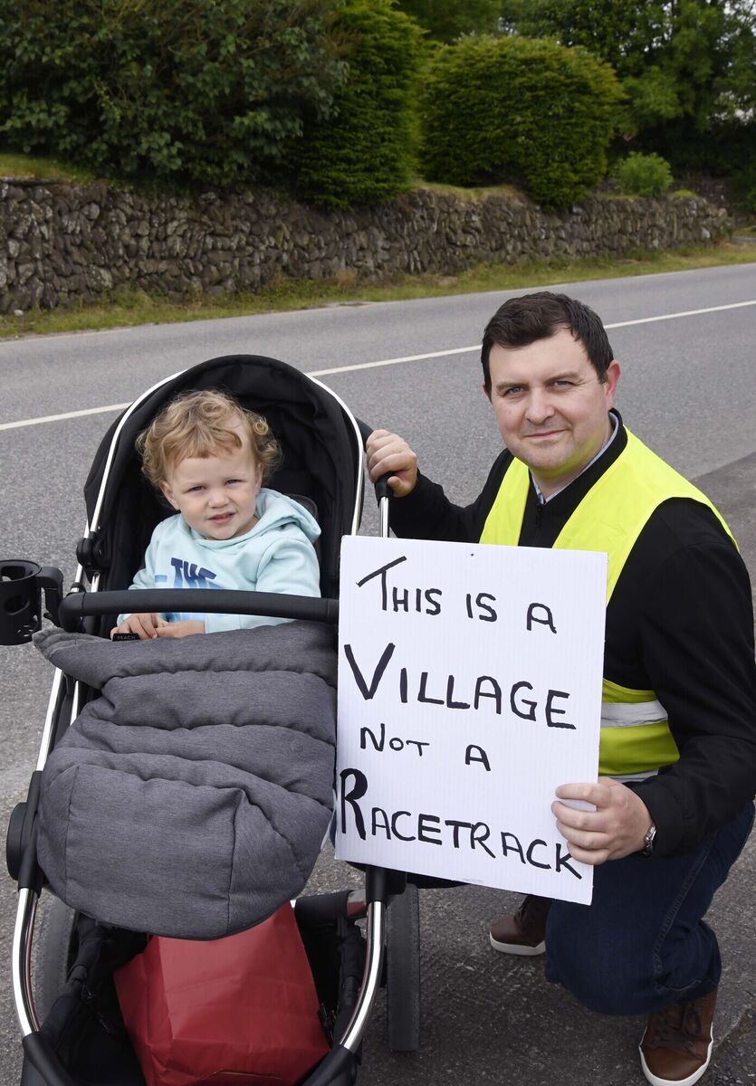 Iain and Seán McGregor taking part in a demonstration by local residents to encourage drivers to slow down in the Clogheen/Kerry Pike area.