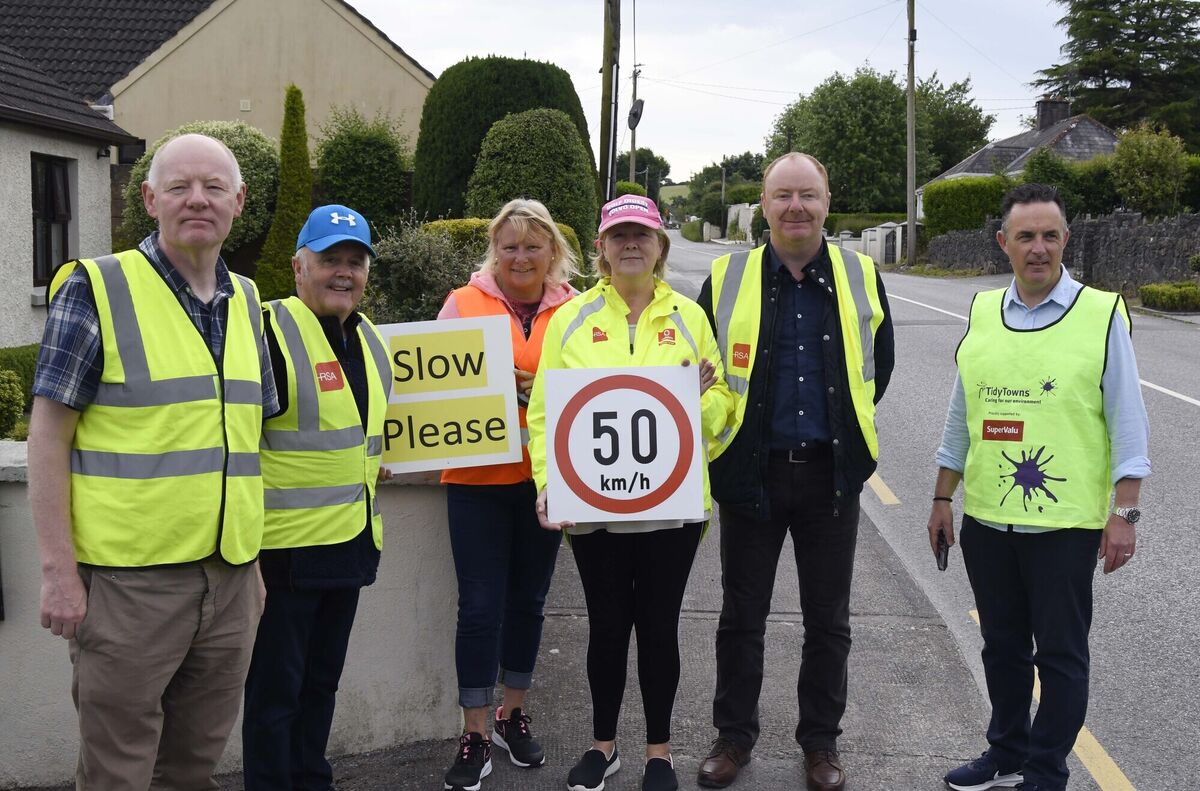 Some local residents and councillors at a demonstration by local residents to encourage drivers to slow down in the Clogheen/Kerry Pike area.