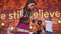 Elbow joined by Little Amal and refugee choir at Glastonbury in ‘special’ moment