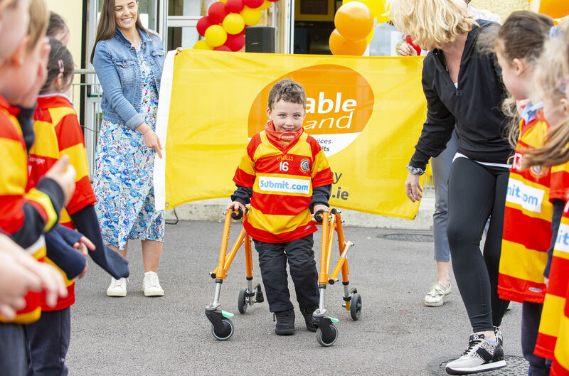 Adam and his Mother Therese Clarke, as he completes the final leg of a mini-marathon in the company of friends and family and raises funds for Enable Ireland. Photography by Gerard McCarthy Photography