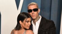 Travis Barker pictured being taken to hospital following medical issue