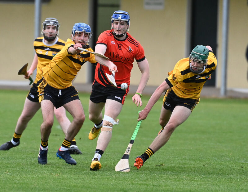 Duhallow's Brandon Murphy is tackled by Carrigdhoun's Gearoid O'Riordan and Michael Murphy. Picture: Eddie O'Hare