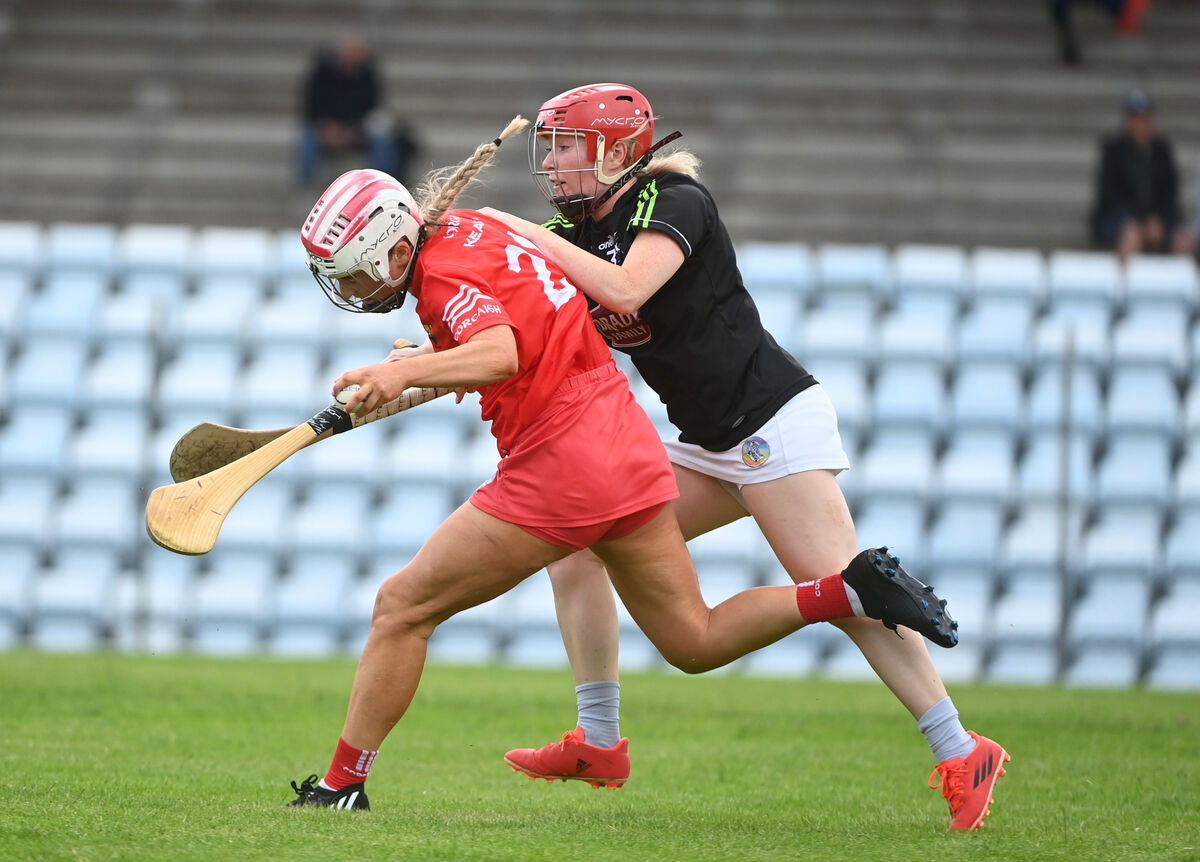  Cliona O'Callaghan, Cork is fouled by Kildare full-back Maria Doyle (Naas) as she races towards goal in Glen Dimplex Camogie All-Ireland Intermediate Championship; Cork Vs Kildare at Pairc Ui Rinn on Saturday 2nd July 2022. Pic: Larry Cummins