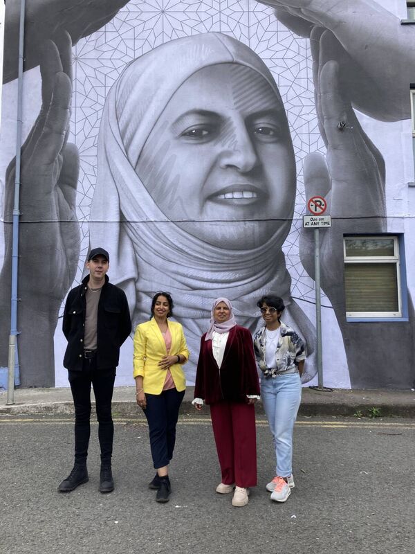 Artist Joe Caslin with Salamah and her daughters Reem (right) and Amal (left). 