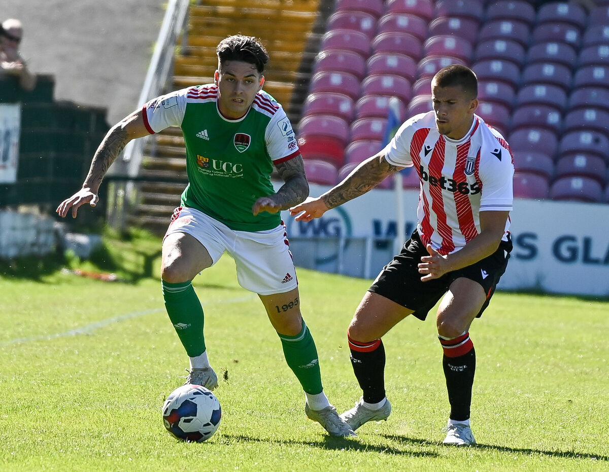  Cork City's Ruairi Keating looks for support as Stoke City's Harry Clarke closes in, during their friendly match at Turner's Cross.