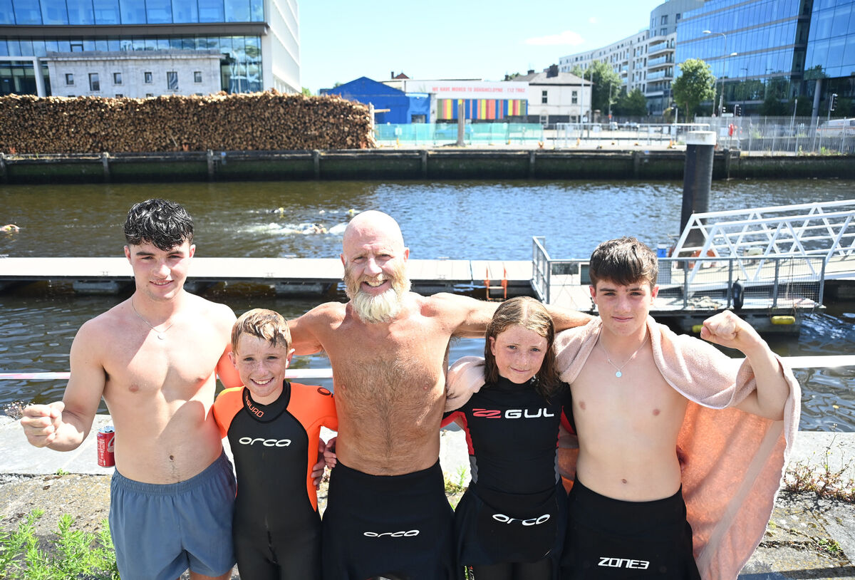  Mighty Penguins......The Neville family from Clonakilty who took part in the swim, pictured at the finish of the Vibes &amp; Scribes Lee Swim 2022 at North Mall, Cork City on Saturday 9th July 2022. Dad Tom Neville of Cork Surf Lifesvaing with Grattan, Isaac and Isabelle of Penguin Swimming Club, and Finian. Pic: Larry Cummins.