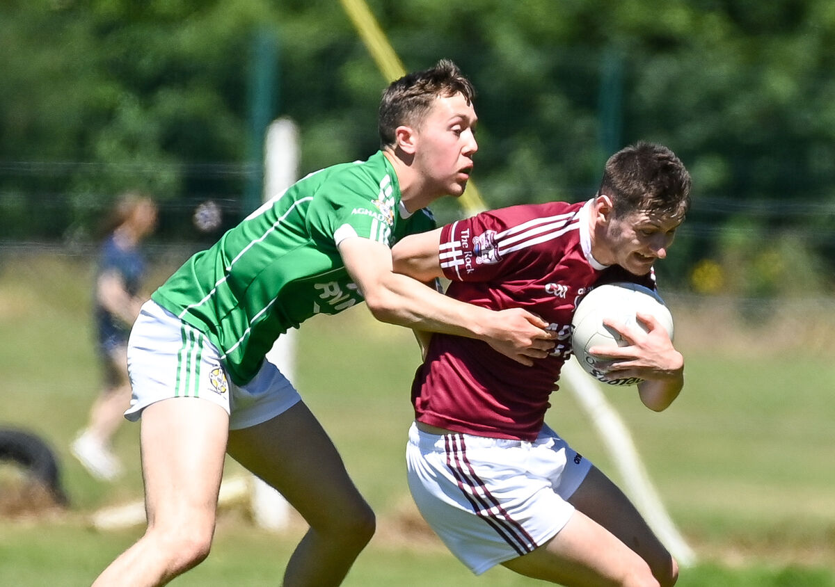  Rockchapel's Jason O'Callaghan is tackled by Aghada's Diarmuid Byrne, during their Division 2 Football League semi-final clash at Rostellan. 