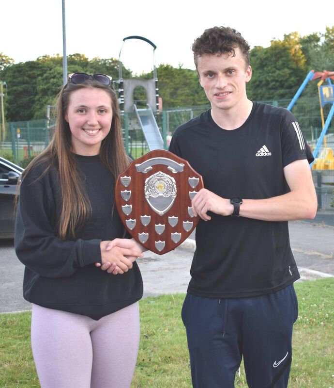 Frank O'Brien, winner of the Corkbeg four-mile road race, receiving the Robbie Steele Memorial Shield from Alana-Rose Steele. Picture: John Walshe Frank O'Brien, winner of the Corkbeg four-mile road race, receiving the Robbie Steele Memorial Shield from Alana-Rose Steele. Picture: John Walshe