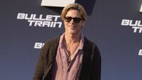 Brad Pitt swaps trousers for a skirt at Berlin red carpet event
