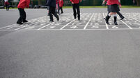 British primary school children playing in the playground