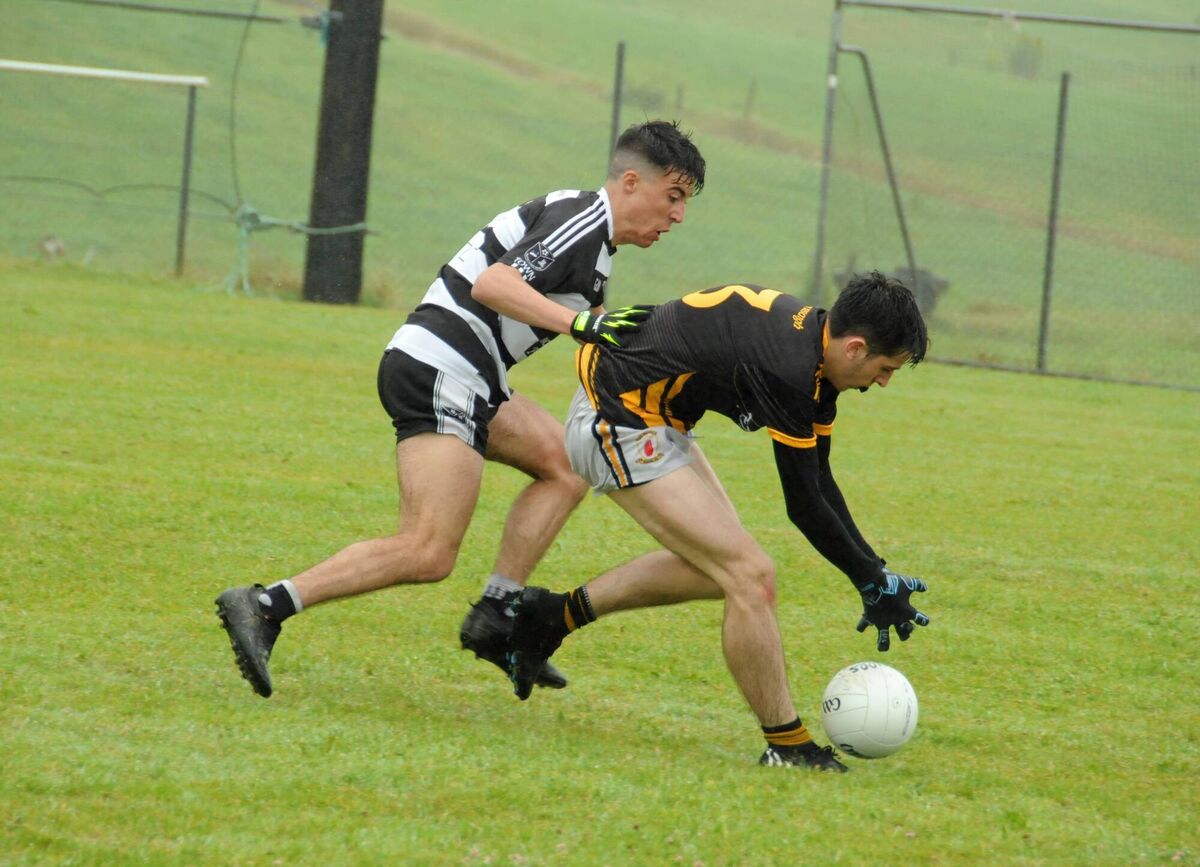 Johnathan Rosales of Castletownbere pressurises Cian Hogan of Na Piarsaigh during the Bon Secours PIFC game in Aughaville. Pic Tony McElhinney Johnathan Rosales of Castletownbere pressurises Cian Hogan of Na Piarsaigh during the Bon Secours PIFC game in Aughaville. Pic Tony McElhinney