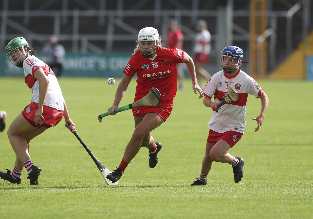 Cork's Katelyn Hickey gets past Derry's Grainne McNicholl and Aoife Shaw. Picture: Patrick Browne