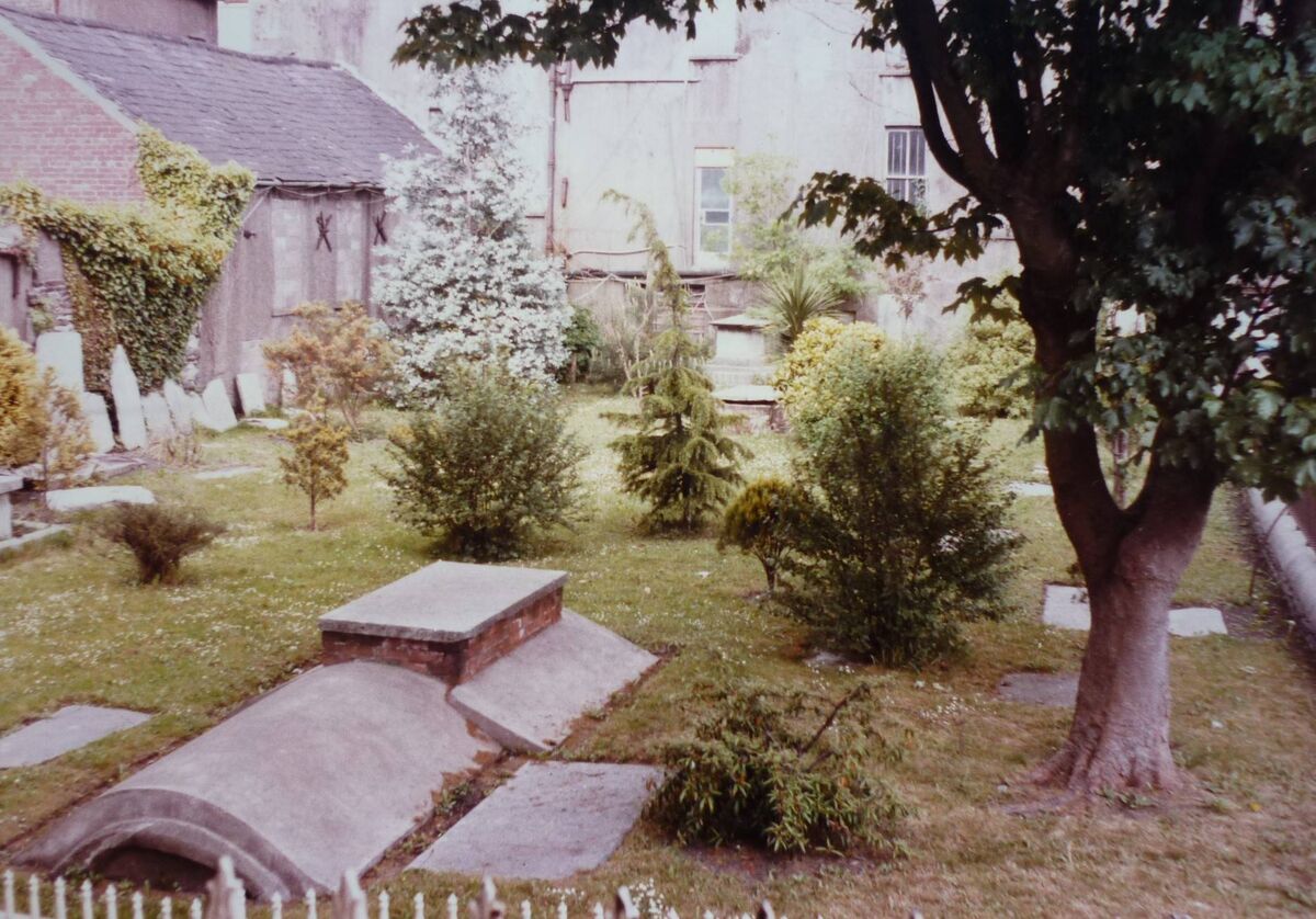 Christ Church ancient burial ground, as seen from Christ Church Lane (this lane is now part of Bishop Lucey Park). In this burial ground are some of Old Cork’s chief citizens who were laid to rest centuries ago - some of their headstones are still with us today, although many were removed during the September Siege of Cork in 1690 to repair breaches made in the city wall. Courtesy: Richard T. Cooke 1984. 