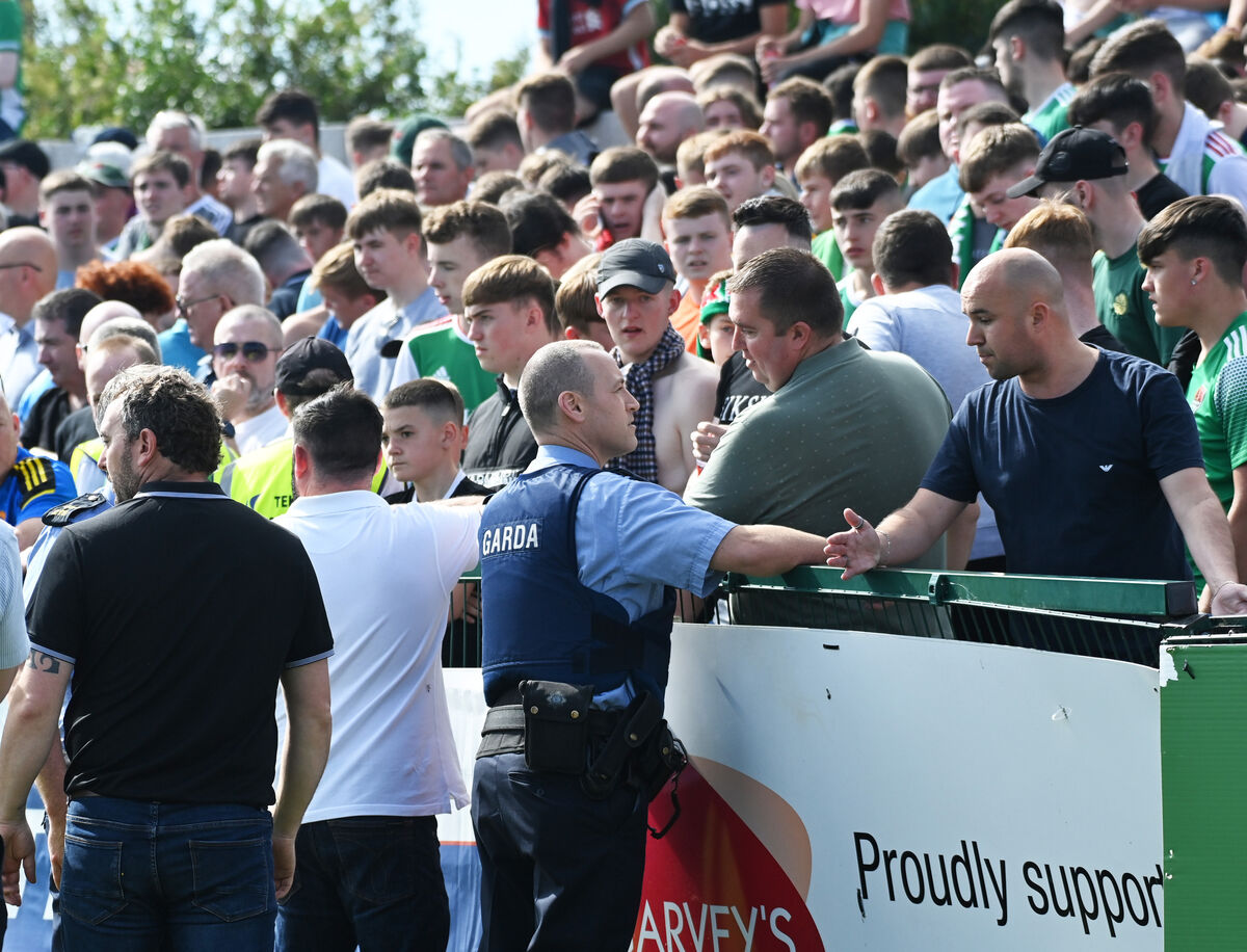 Gardai and Cork City's head of security Robbie Kelleher speaking with Cork City fans after a fence gave way during the FAI cup against Cobh Ramblers at St Colman's park. Picture; Eddie O'Hare Gardai and Cork City's head of security Robbie Kelleher speaking with Cork City fans after a fence gave way during the FAI cup against Cobh Ramblers at St Colman's park. Picture; Eddie O'Hare